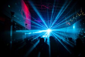 An event center at night with lasers